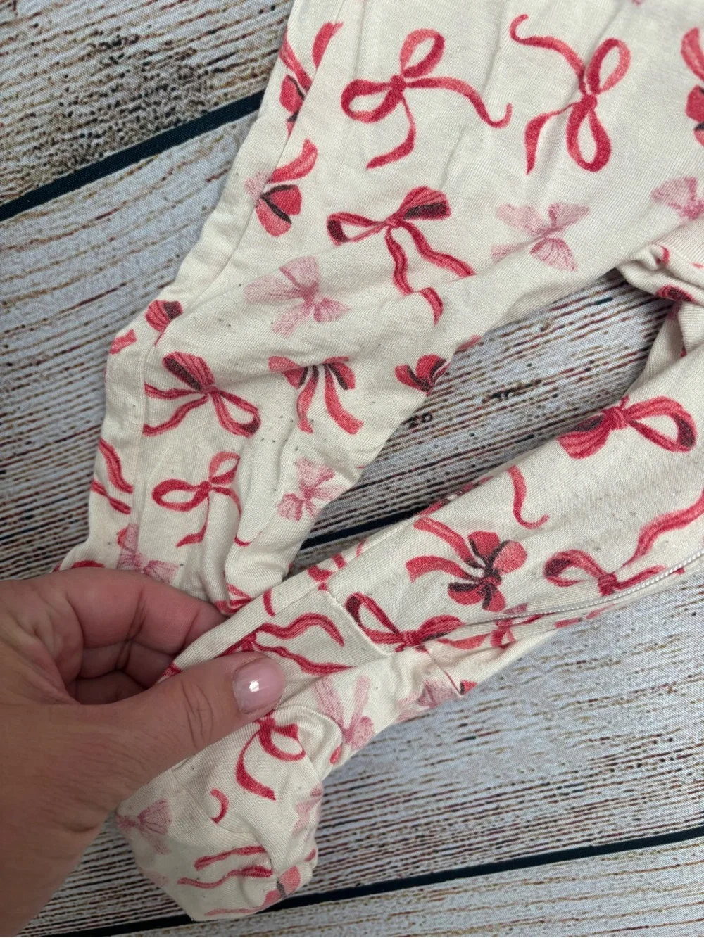 Pottery Barn Kids Long-Sleeve Footed One-Piece with Red Bow Print